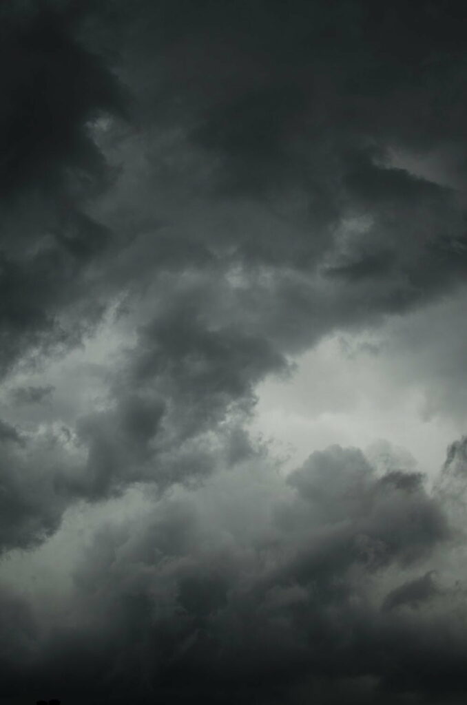 Dramatic HD Phone Wallpaper: Intense Moody Sky with Dark Clouds
