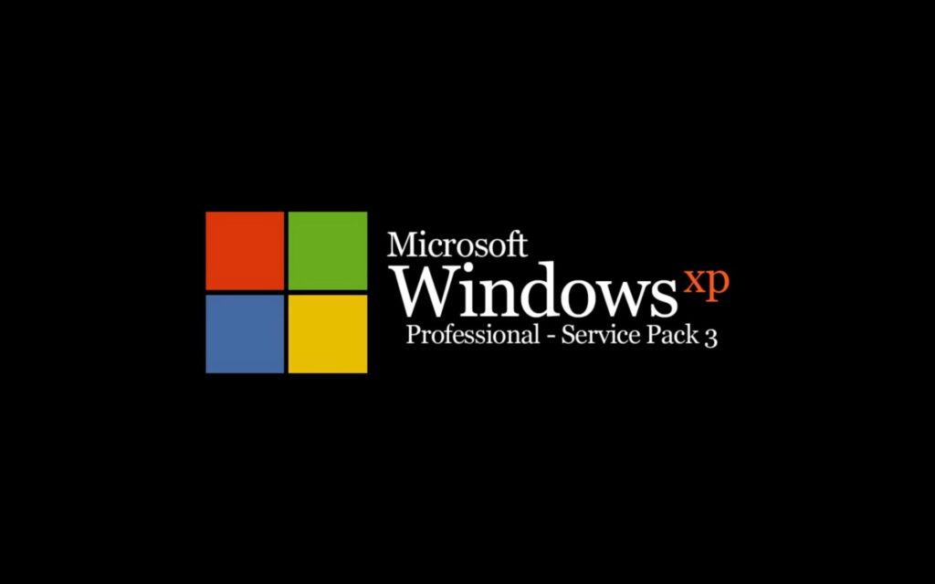 Vintage Microsoft Windows XP Professional Boot Screen with Nostalgic Four-Color Logo on Black Background - Throwback OS Image Wallpaper