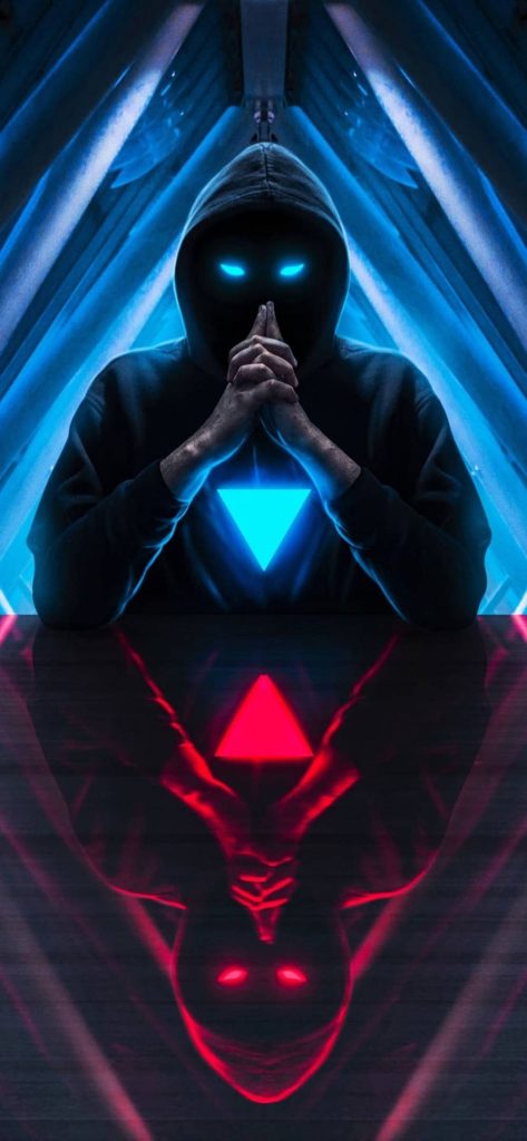 Hooded figure with glowing blue eyes and sci-fi chest emblem blue and red hacker wallpaper