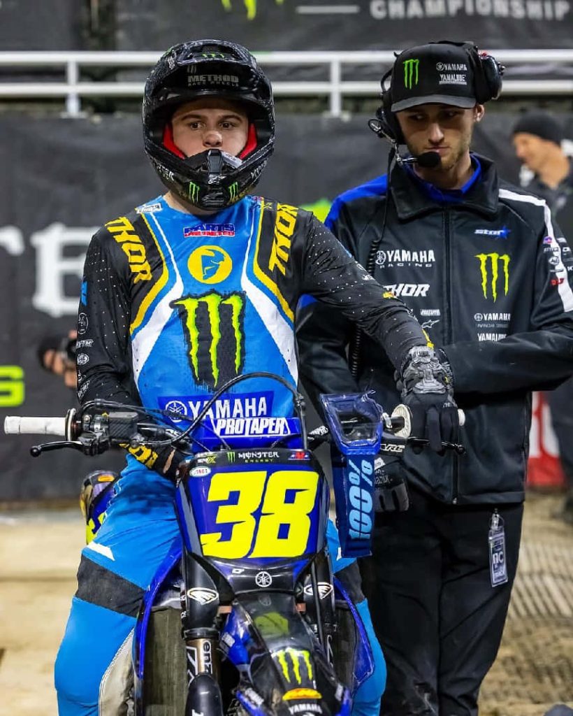 Haiden Deegan #38 Monster Energy Yamaha rider with mechanic in blue yellow gear motocross wallpaper