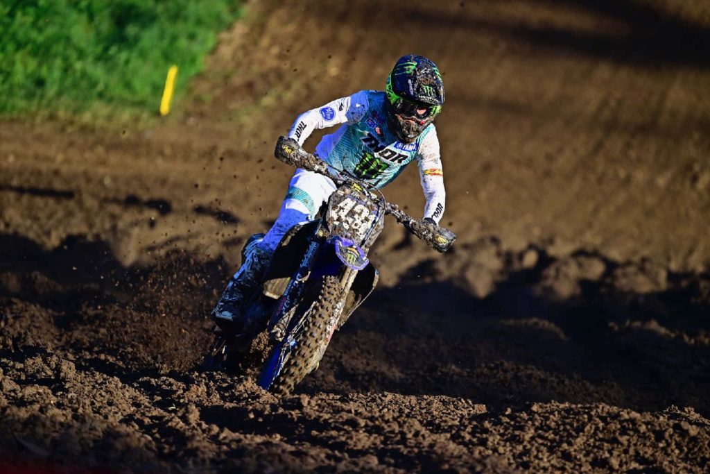 Haiden Deegan motocross action on Yamaha 38 bike racing muddy track in sunlight wallpaper