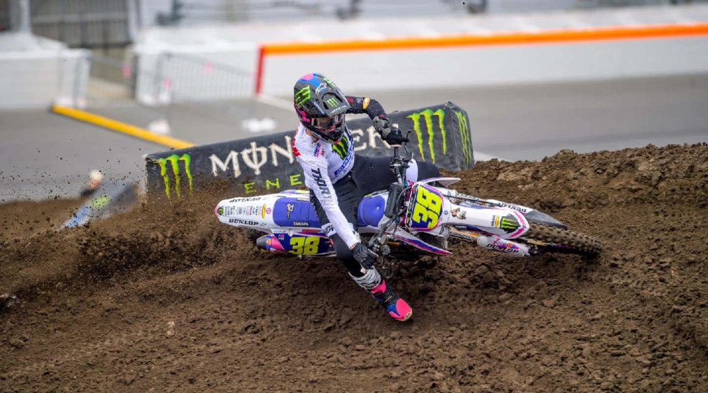 Haiden Deegan racing Yamaha dirt bike on muddy motocross track Monster Energy rider action Wallpaper