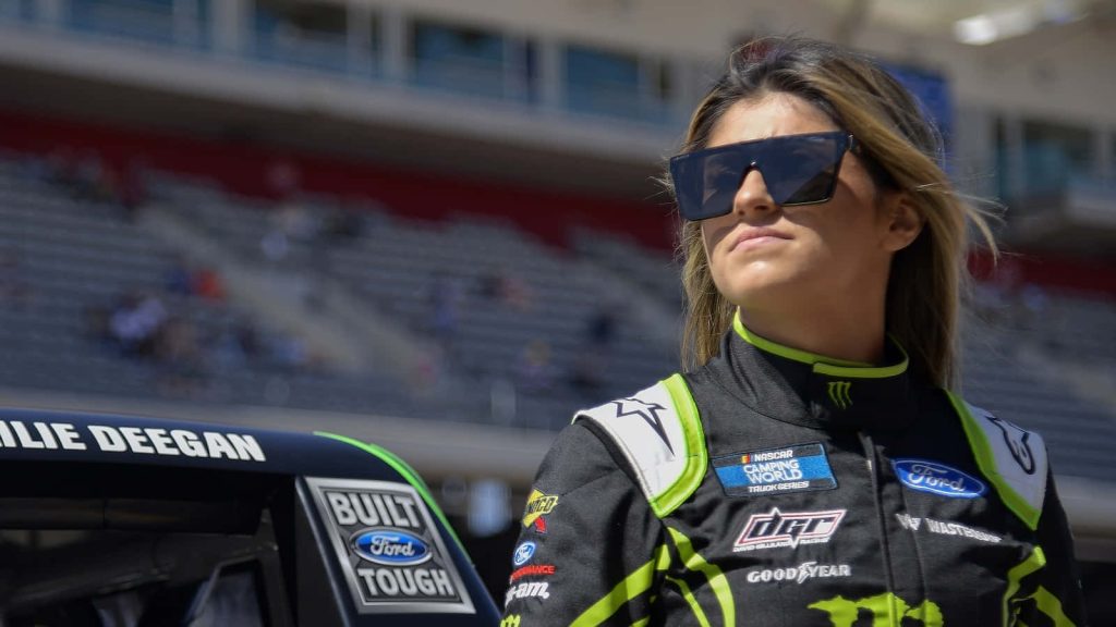 Hailie Deegan in black neon green David Gilliland Racing suit trackside NASCAR driver wallpaper