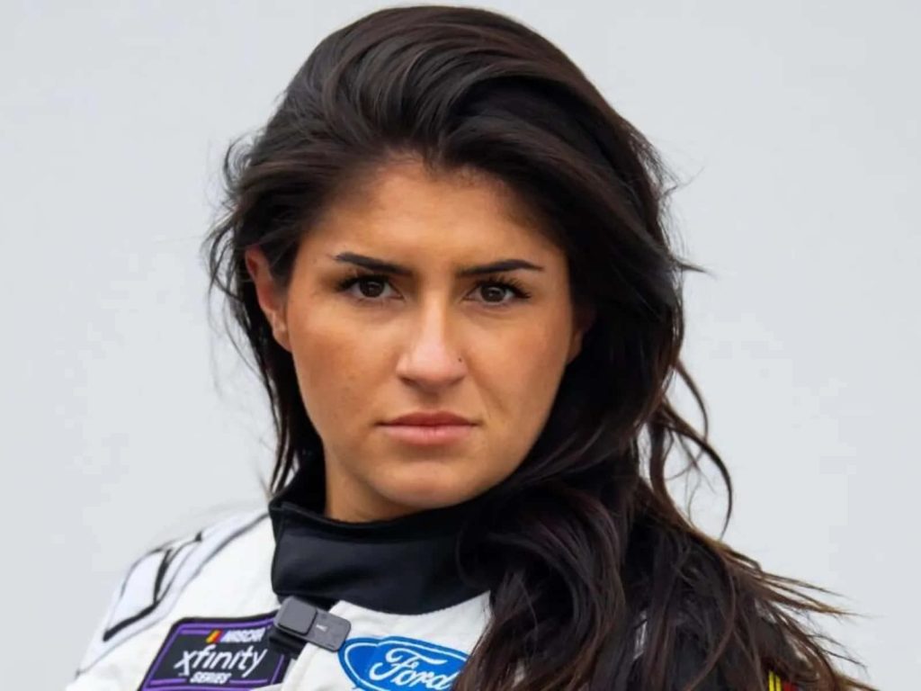 Hailie Deegan NASCAR driver portrait in white Ford Xfinity suit with focused expression wallpaper
