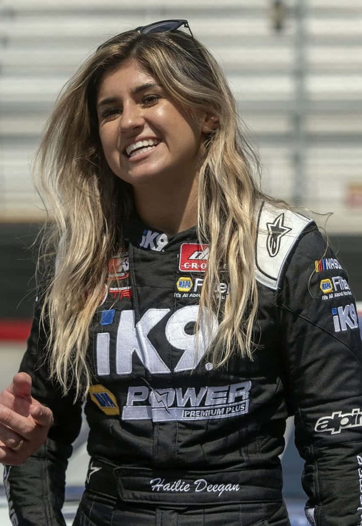 Race car driver Hailie Deegan in black iK9 racing suit vibrant motorsports desktop wallpaper