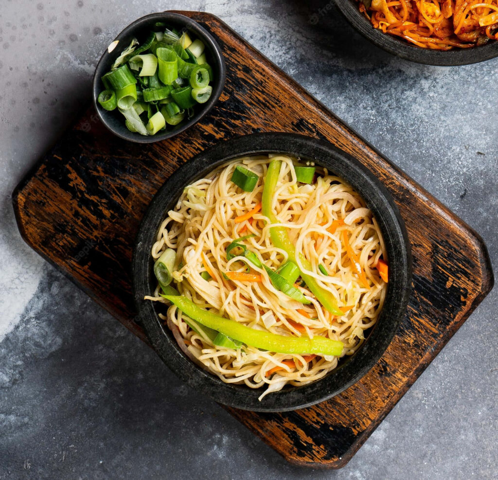 Rustic Hakka Noodles with Fresh Spring Onions - Wallpaper Background