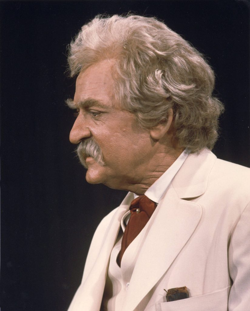 Hal Holbrook as Mark Twain in white suit red tie dark background classic literature portrait Wallpaper