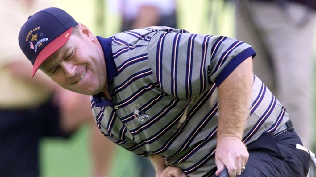 Hal Sutton focused reading green in Ryder Cup cap striped polo professional golf wallpaper