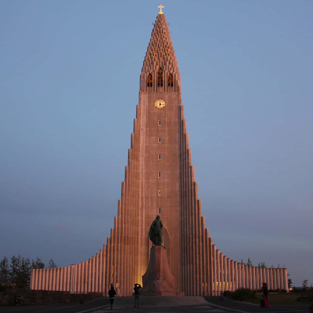 Hallgrímskirkja church and Leif Erikson statue at sunset in Reykjavík Iceland serene scene Wallpaper