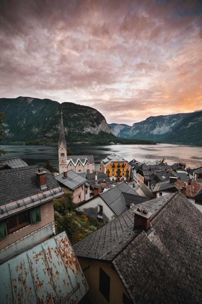 Hallstatt Austria sunset view with colorful rooftops lake and majestic mountains HD wallpaper