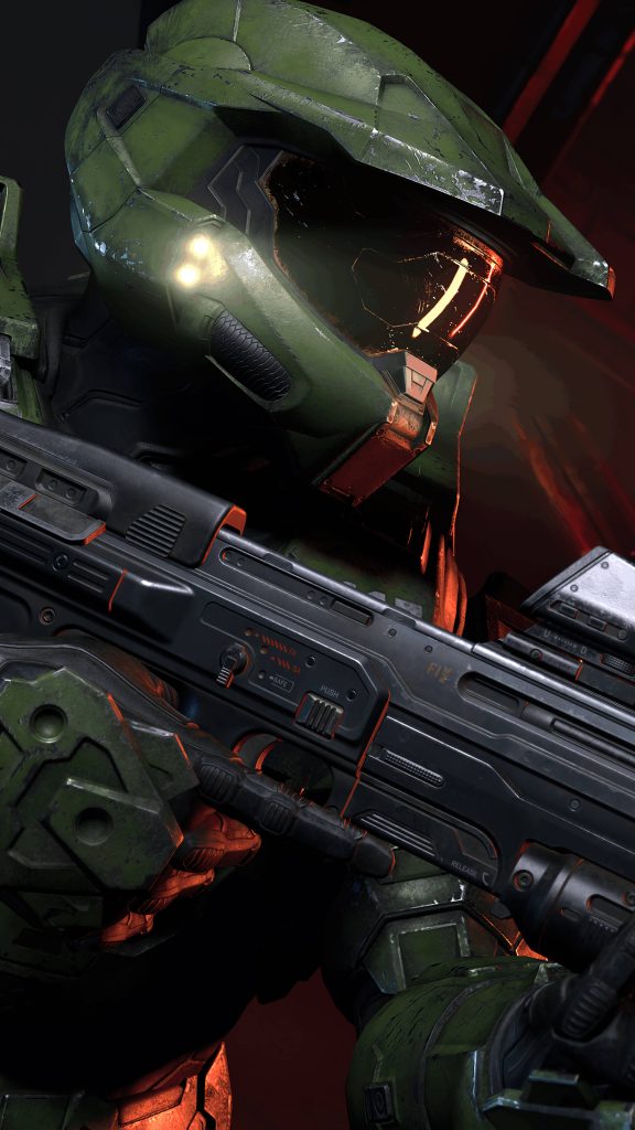 Halo Infinite wallpaper Master Chief in green armor with glowing visor and assault rifle background