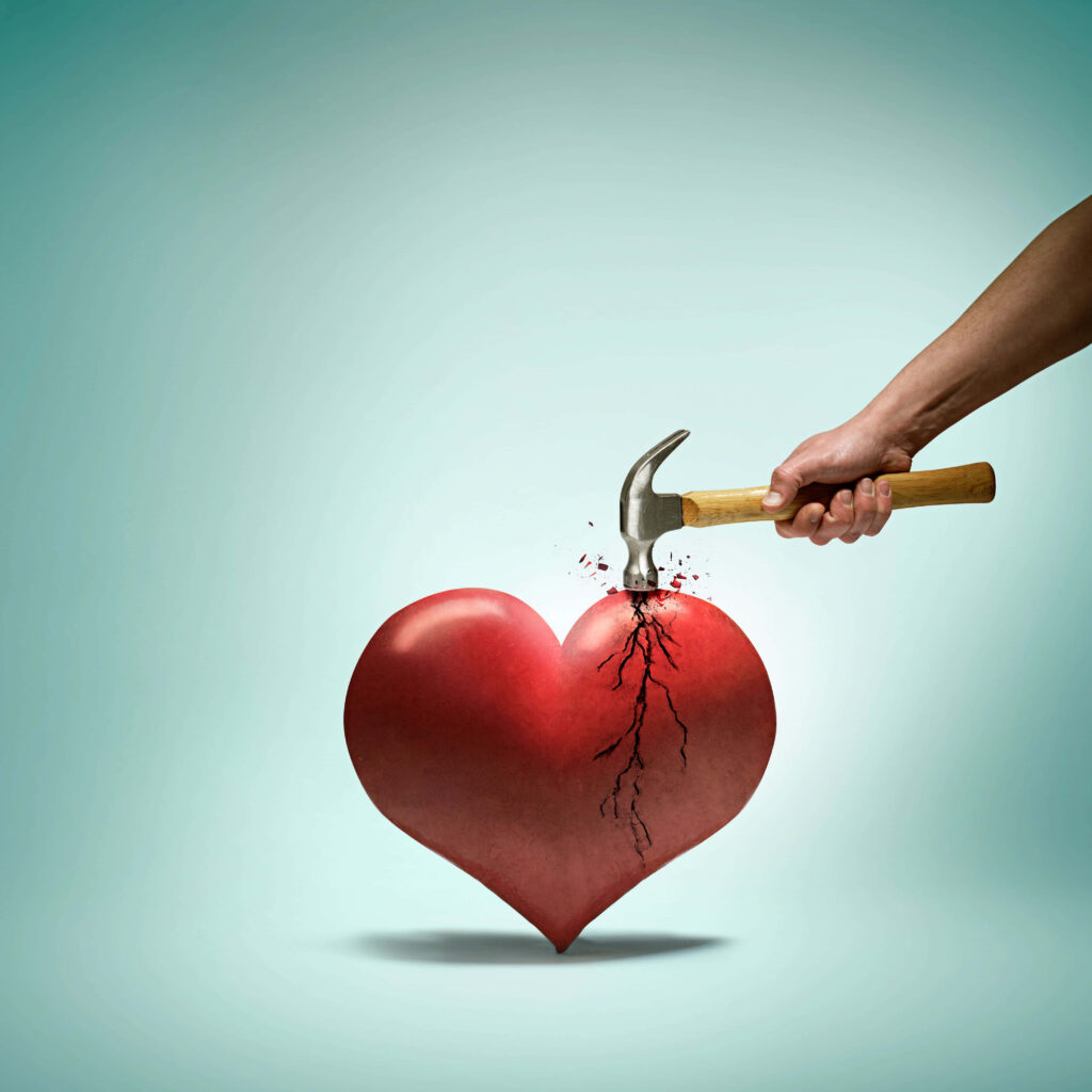 Emotional Wallpaper: Hand with Hammer Striking Heart on Green Background