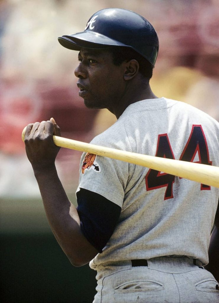 Hank Aaron in Atlanta Braves jersey number 44 vintage baseball portrait with bat on shoulders Wallpaper