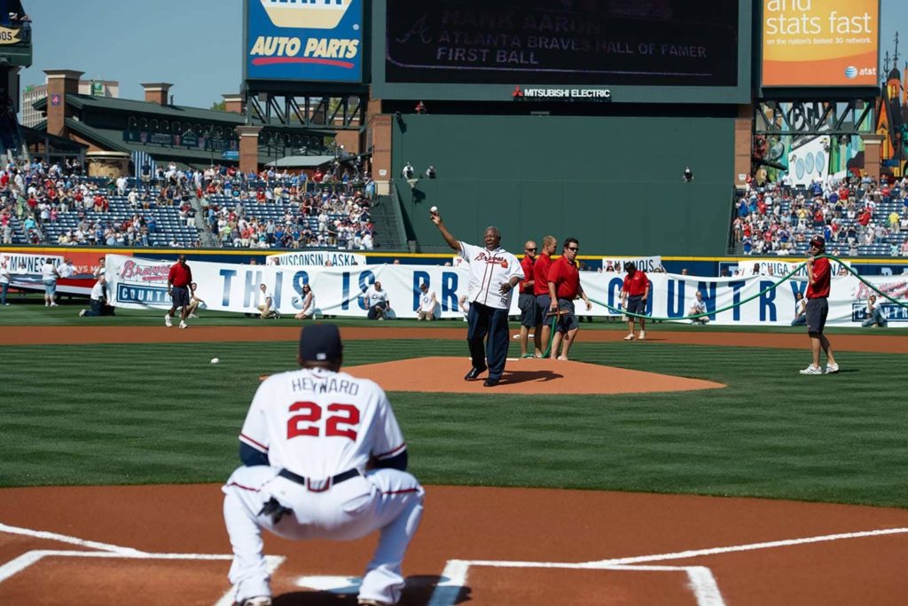 Hank Aaron ceremonial first pitch at Atlanta Braves game with catcher Jason Heyward wallpaper