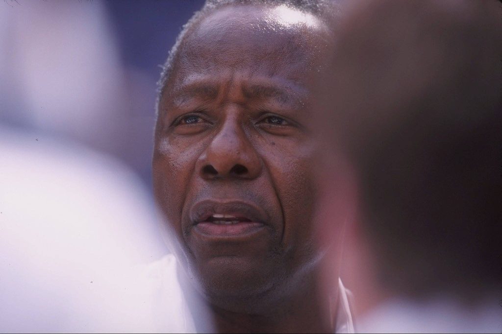 Close-up portrait of baseball legend Hank Aaron with soft lighting and blurred background wallpaper