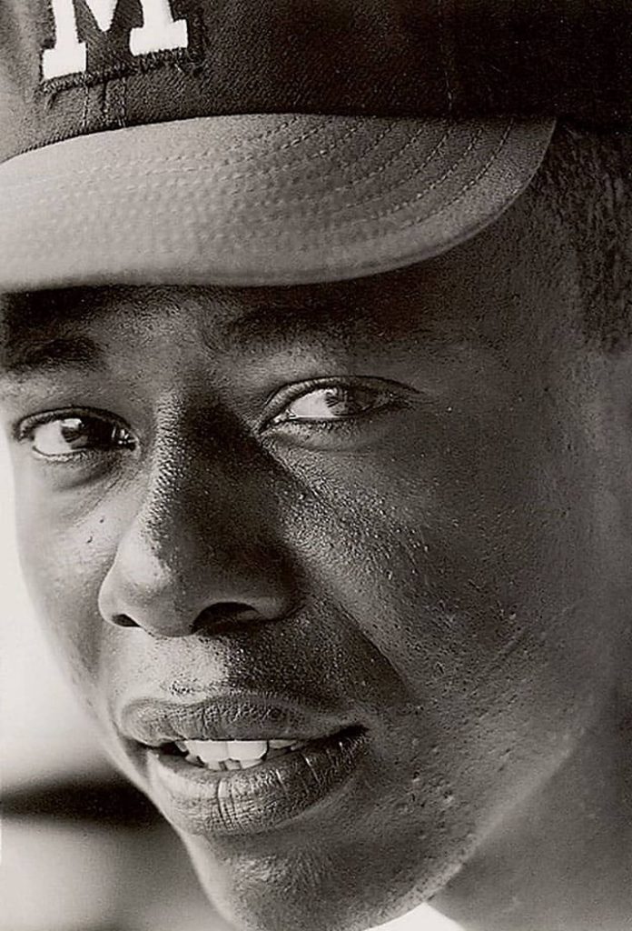 Close-up black and white portrait of Hall of Famer Hank Aaron in Milwaukee cap baseball wallpaper