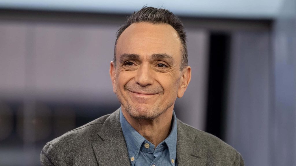 Hank Azaria portrait wallpaper warm smile grey blazer blue shirt professional desktop background