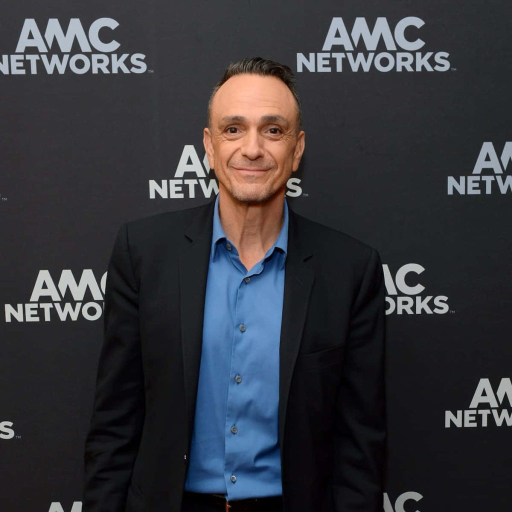 Hank Azaria in blue shirt and black blazer posing at AMC Networks event professional portrait Wallpaper