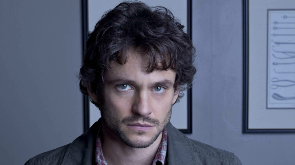 Hannibal Wallpaper: Intense Protagonist in Minimalist Background