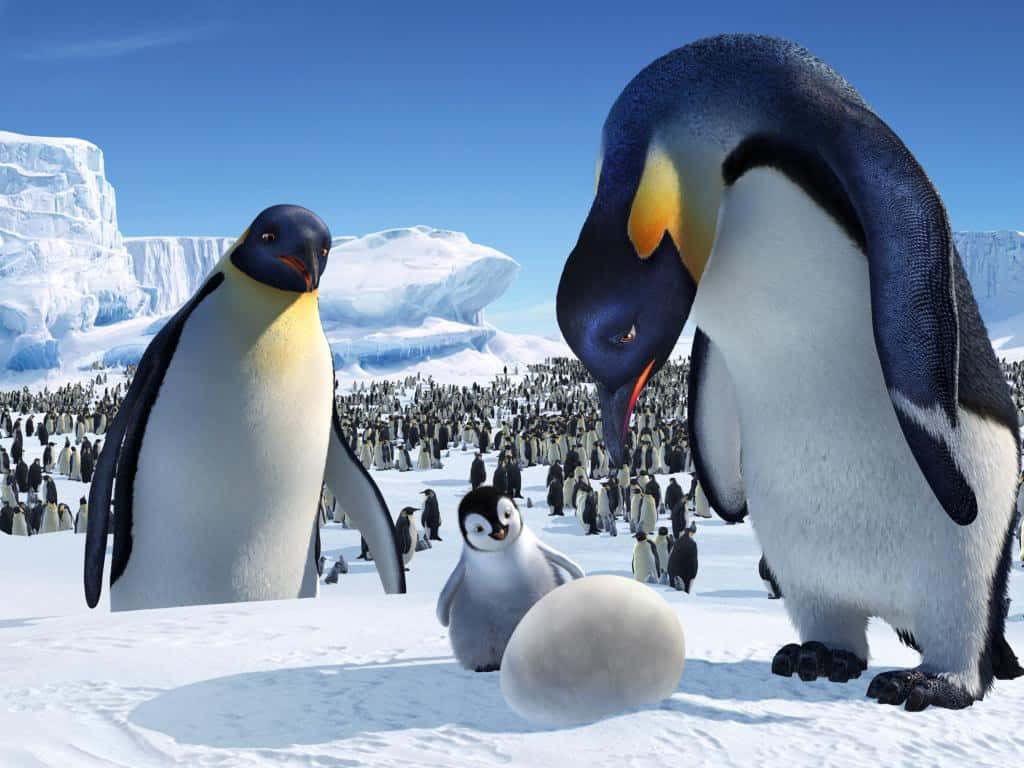 Happy Feet Two CGI wallpaper Emperor penguins protecting chick and egg on icy glacier background