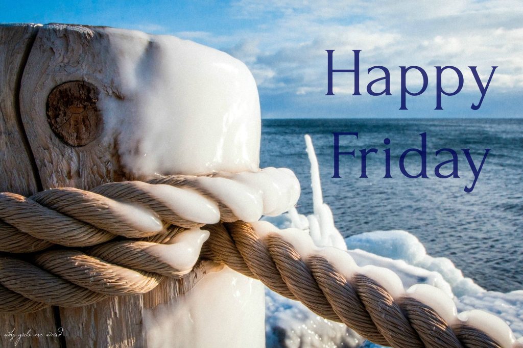 Frozen icicles on rustic post and rope by sunlit winter ocean Happy Friday wallpaper background