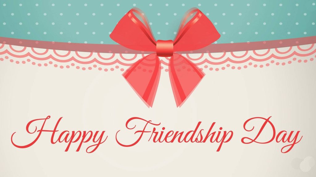 Festive Friendship Day wallpaper with red ribbon cream teal polka dots and cursive greeting