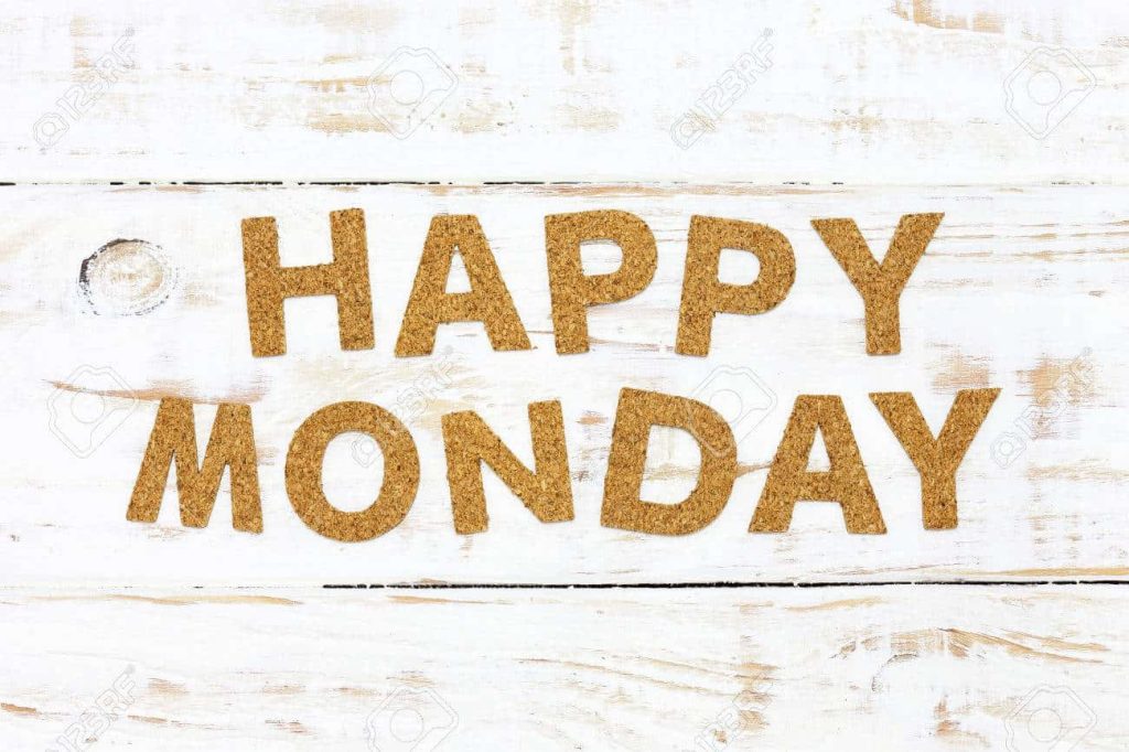 Happy Monday text in sandy brown on rustic white wood background motivational wallpaper