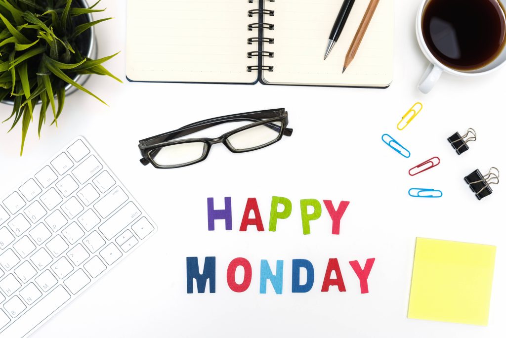 Happy Monday workspace flat-lay with colorful stationery succulent keyboard and notebook background Wallpaper