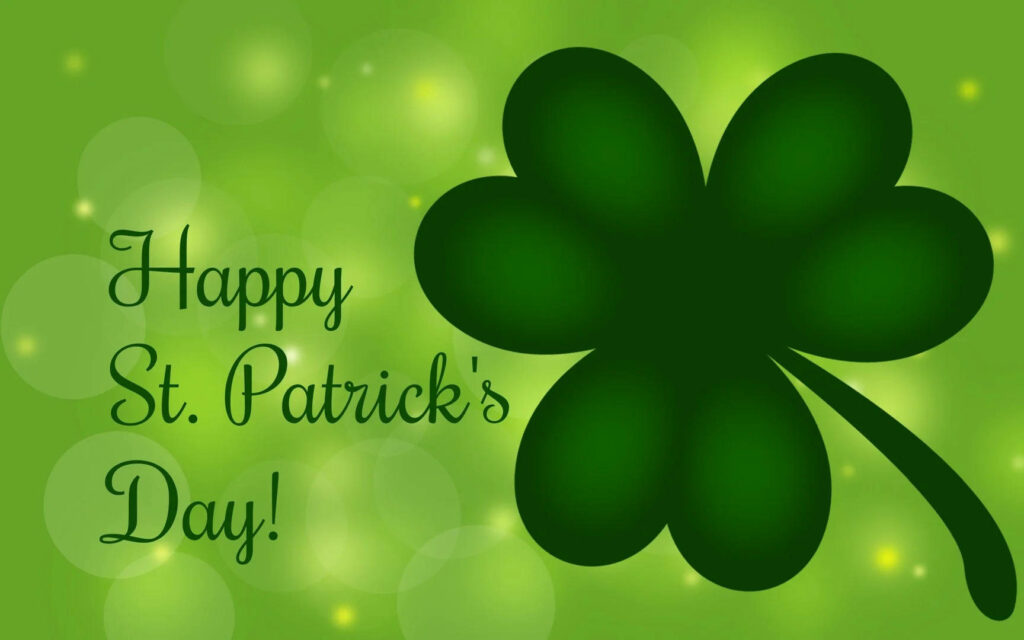 Happy St Patricks Day wallpaper with vibrant green background and large dark green clover design