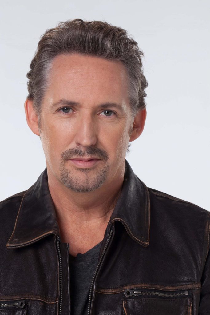 High-definition portrait of actor Harland Williams in brown leather jacket studio headshot Wallpaper