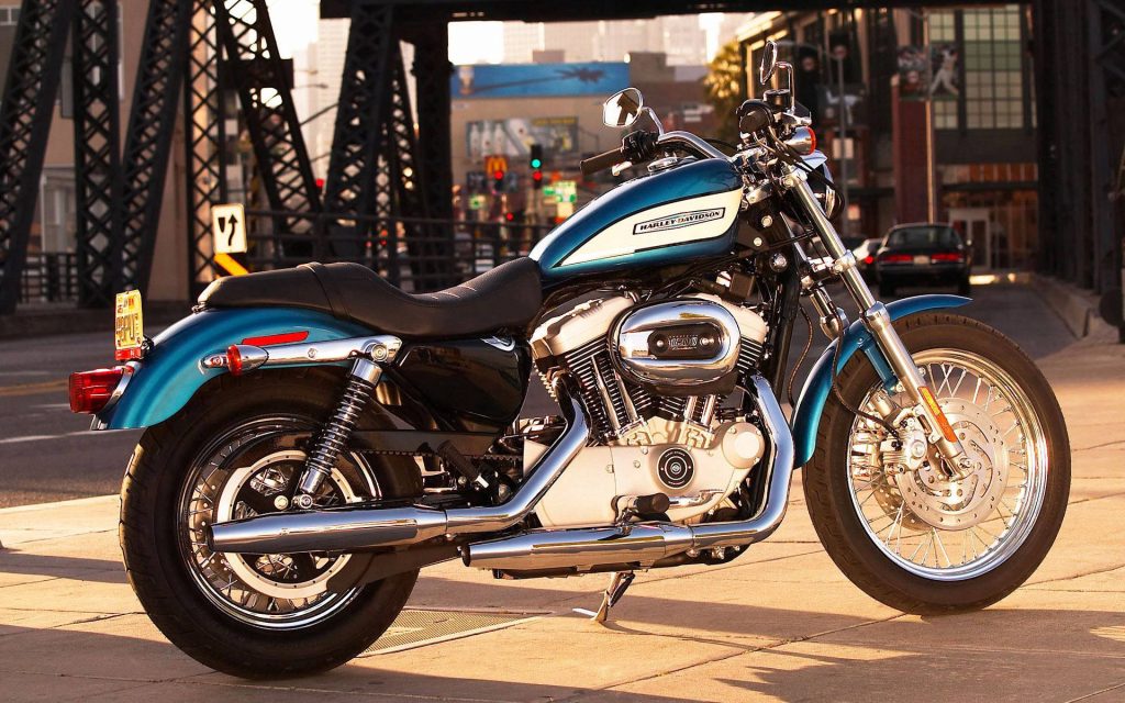 Harley-Davidson Sportster 1200 teal silver motorcycle city bridge warm golden hour wallpaper