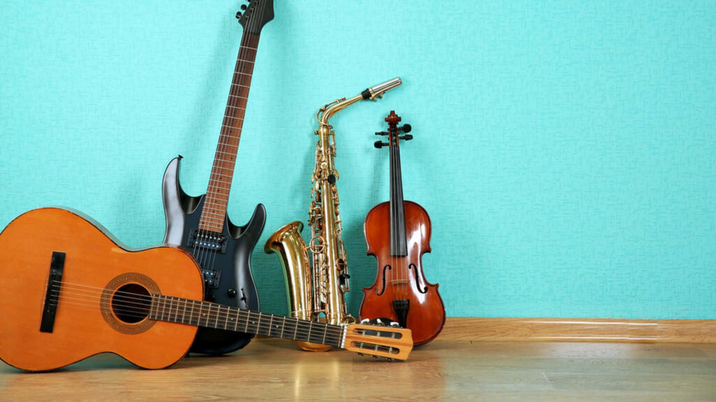 Musical Instruments Wallpaper: Guitar, Saxophone & Violin on Teal Wall