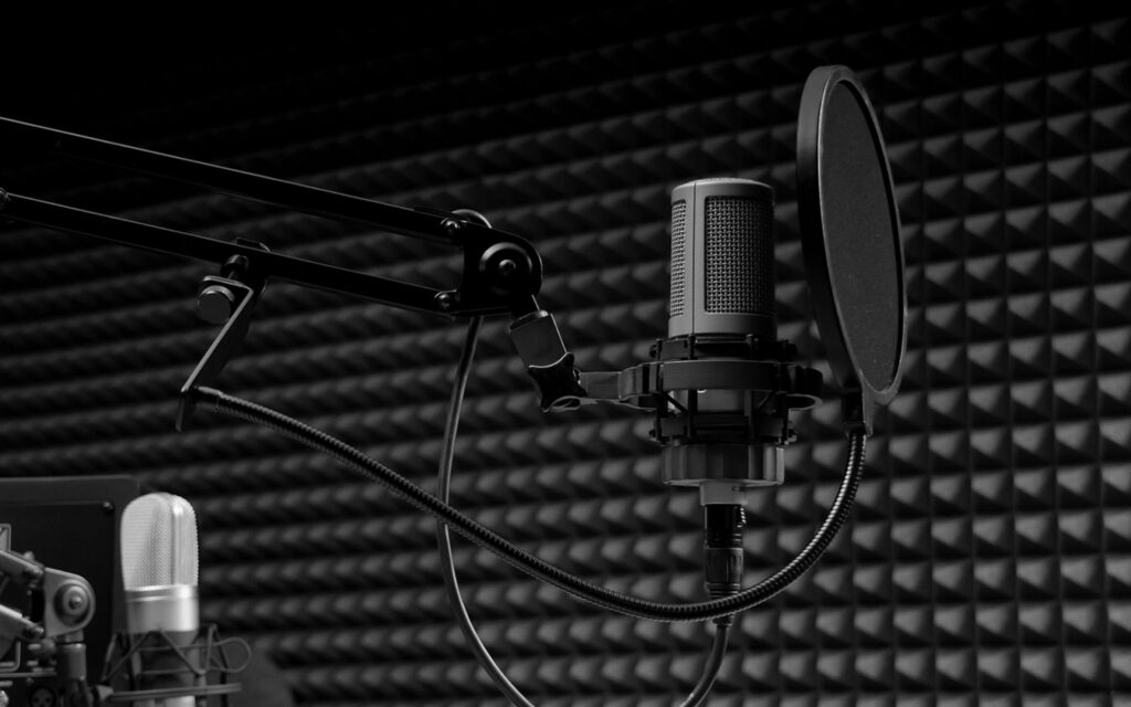 Voices in Harmony: Capturing the Essence of Sound Recording Studio on a QHD Wallpaper Background Photo