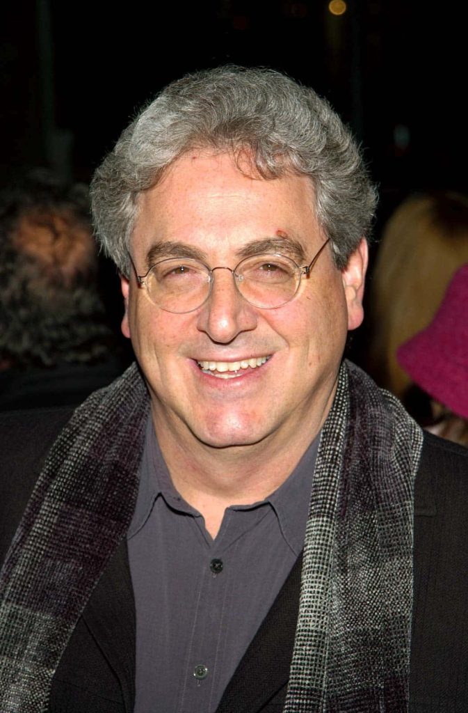 Portrait of Harold Ramis in glasses and scarf bright close-up wallpaper tribute to Ghostbusters star