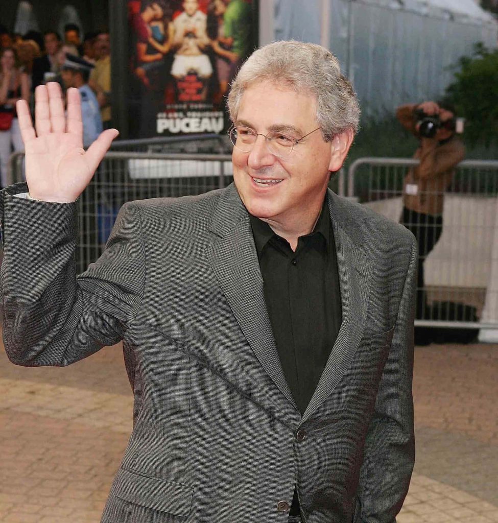 Harold Ramis smiling waving on red carpet in gray suit and glasses iconic Ghostbusters filmmaker Wallpaper