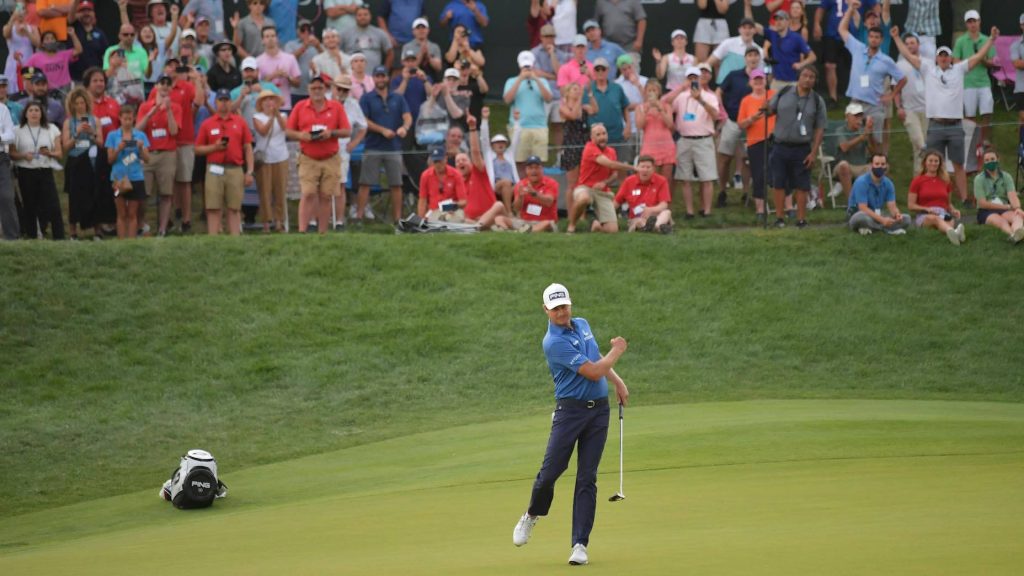 PGA Tour pro Harris English fist pump celebrating clutch shot on green with cheering crowd wallpaper