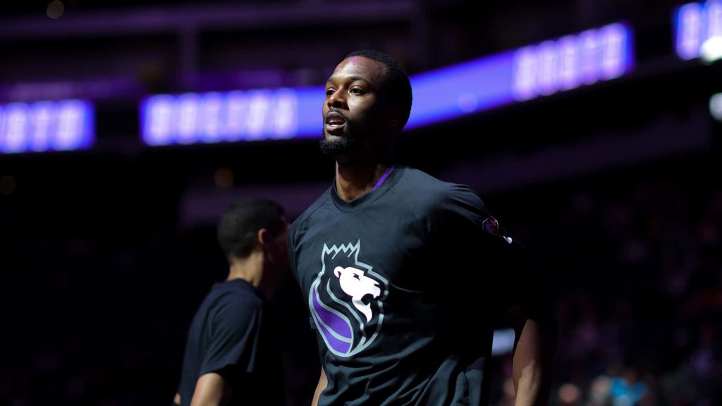 Harrison Barnes Sacramento Kings NBA forward in black warmup gear with purple arena lighting Wallpaper