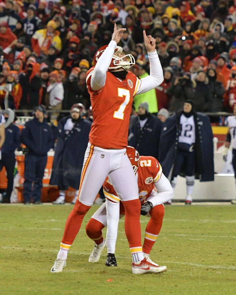 Harrison Butker celebrating field goal Kansas City Chiefs vibrant stadium NFL action wallpaper