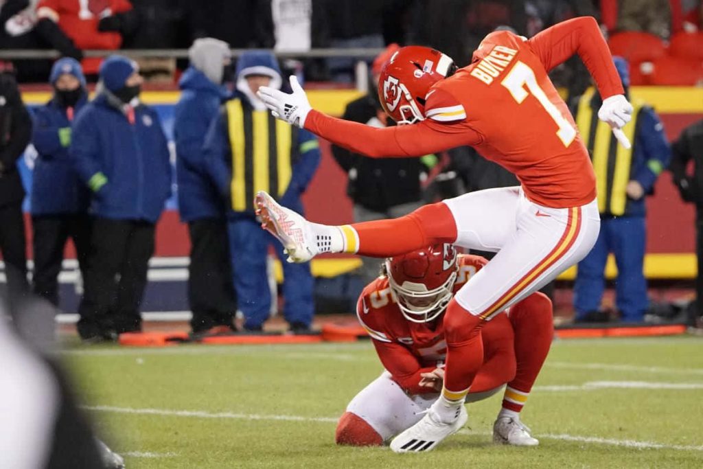 Harrison Butker Kansas City Chiefs field goal kick vibrant football action wallpaper background