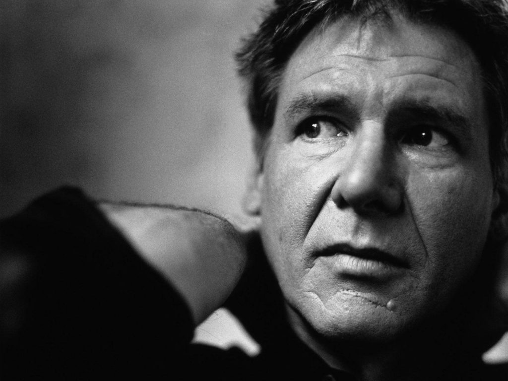 Harrison Ford black and white portrait with dramatic lighting and intense contemplative expression wallpaper