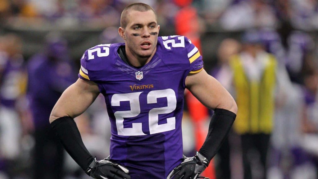 Minnesota Vikings safety Harrison Smith in purple jersey intense game day action wallpaper background
