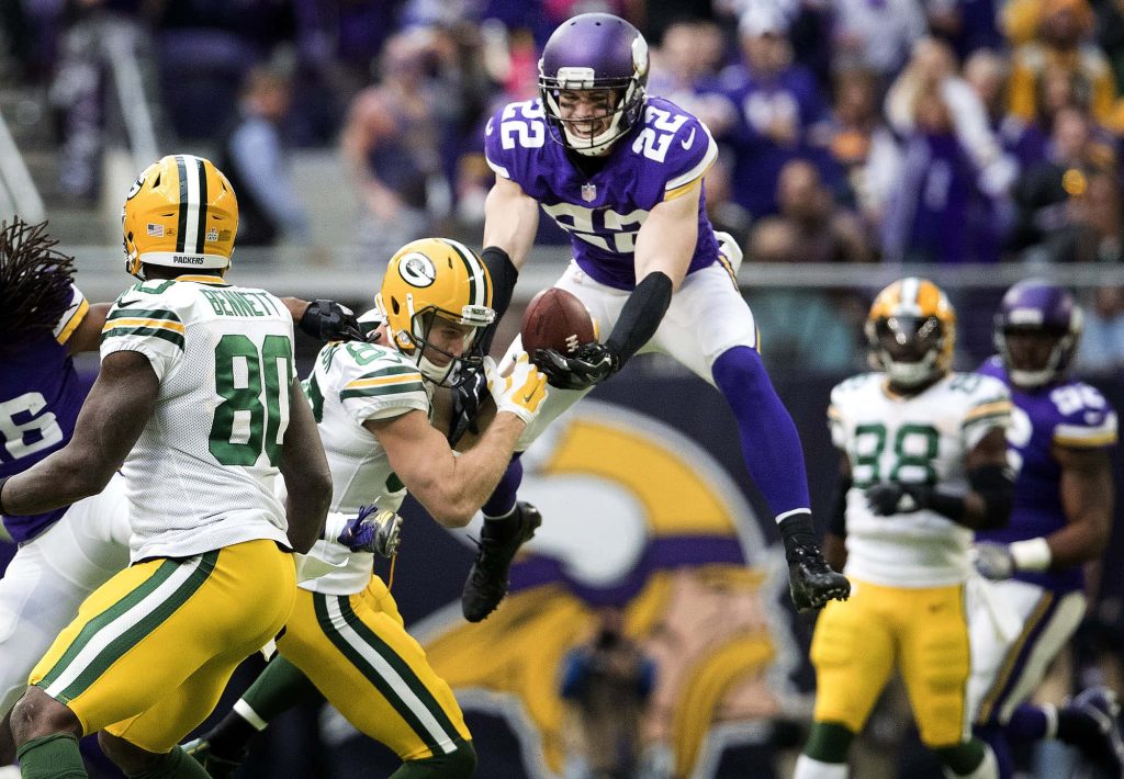 Harrison Smith leaps for interception NFL Vikings vs Packers dynamic football wallpaper background