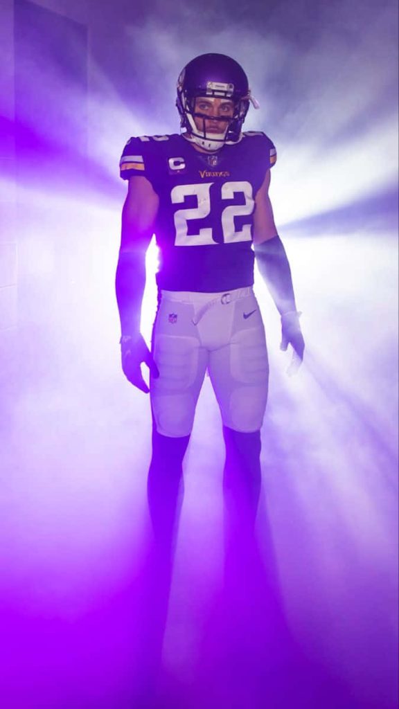 Minnesota Vikings safety Harrison Smith in number 22 jersey amid dramatic purple stadium fog Wallpaper