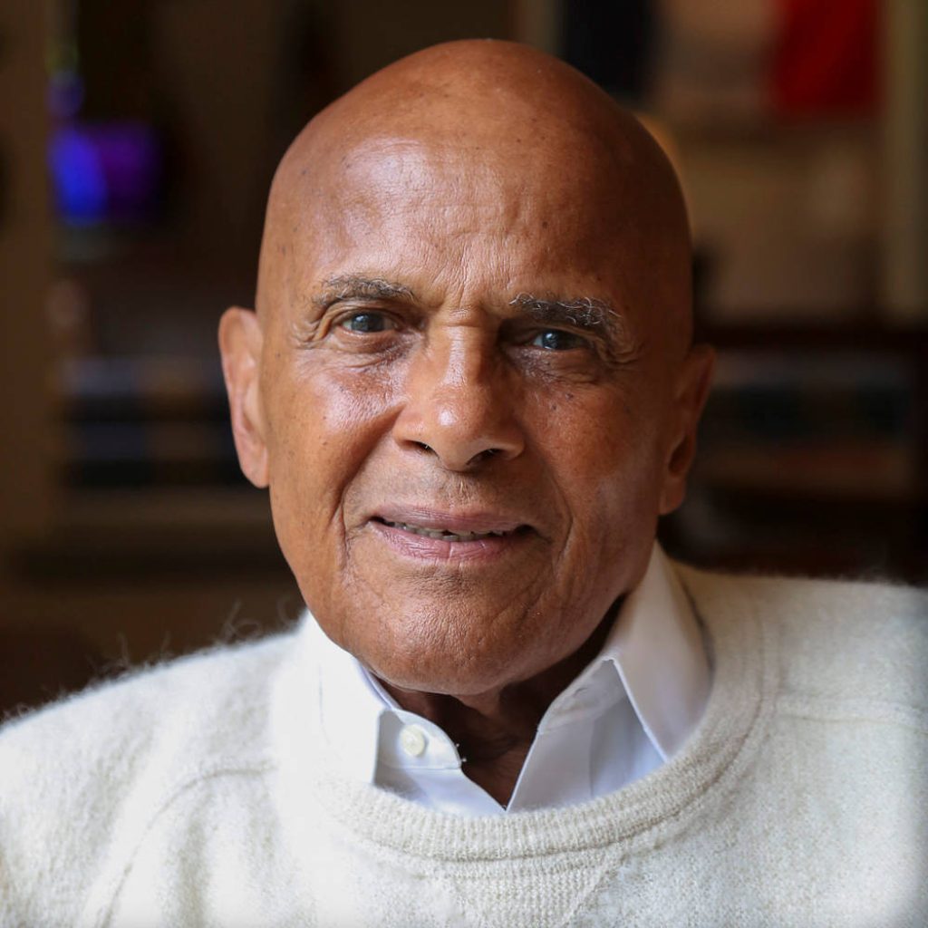 Close-up portrait of Harry Belafonte in cream sweater thoughtful expression cultural icon wallpaper