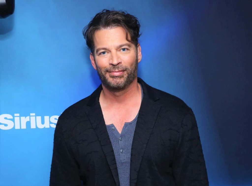 High-resolution portrait of Harry Connick Jr in SiriusXM studio wearing black blazer and blue shirt Wallpaper