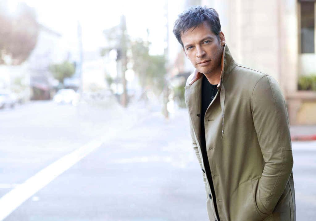 Harry Connick Jr. outdoors city street stylish olive jacket black shirt calm expression bright light Wallpaper