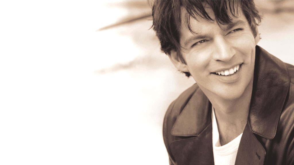 Harry Connick Jr sepia portrait smiling in classic leather jacket warm soft lighting wallpaper