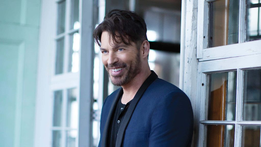 Harry Connick Jr portrait in blue blazer smiling against white frame high resolution wallpaper background