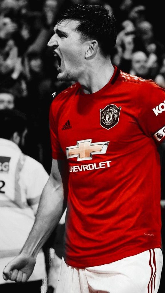 Harry Maguire Manchester United intense portrait red kit selective color football wallpaper