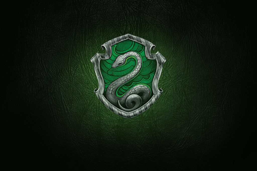 Slytherin house crest on dark green textured leather background Harry Potter wallpaper